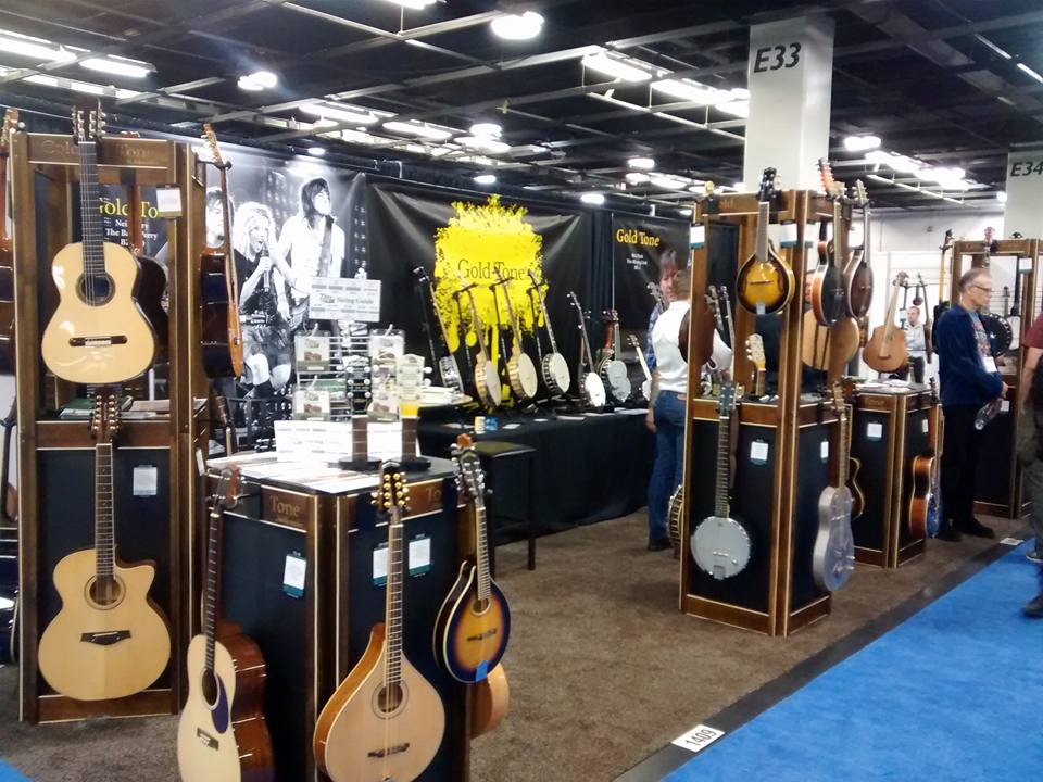 NAMM show booth with string instruments.